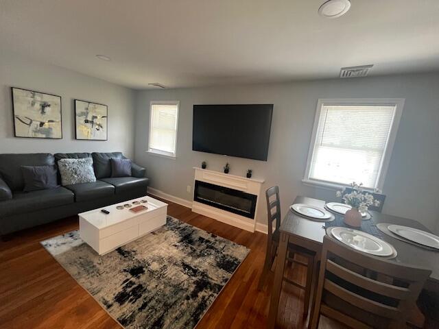 100 Broad Street, Unit E Stroudsburg, PA 18360 - Photo 5 of 25 a living room with furniture and a flat screen tv