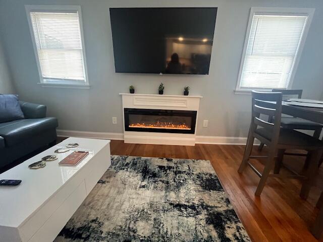 100 Broad Street, Unit E Stroudsburg, PA 18360 - Photo 7 of 25 a living room with a flat screen tv and a fireplace