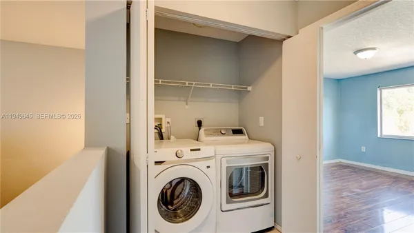 a view of a storage & utility room with washer and dryer