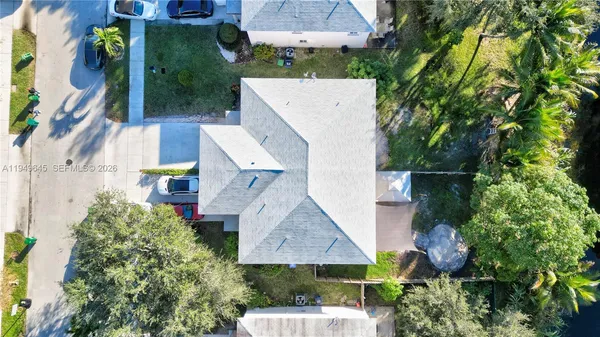 an aerial view of residential houses with city view