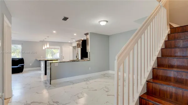 a view of entryway and workspace