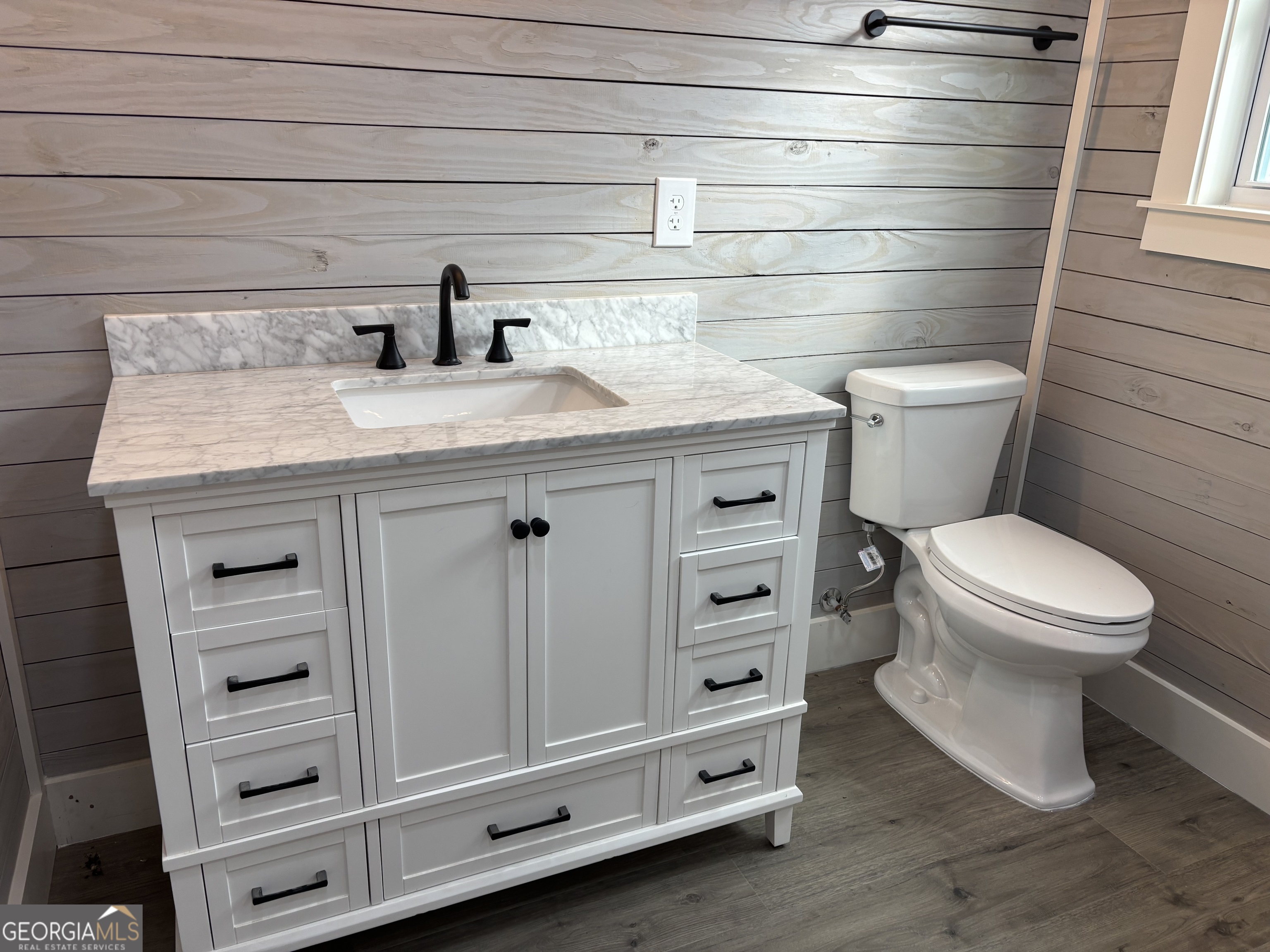 15 Alexander Street Rome, GA 30165 - Photo 11 of 19 a bathroom with a granite countertop toilet and sink