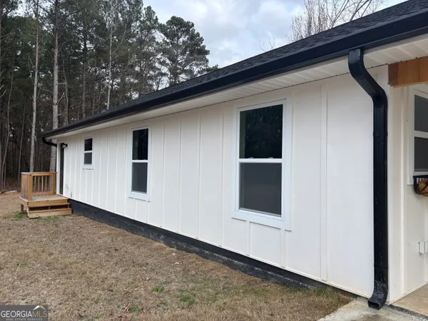 a backyard of a house with garage