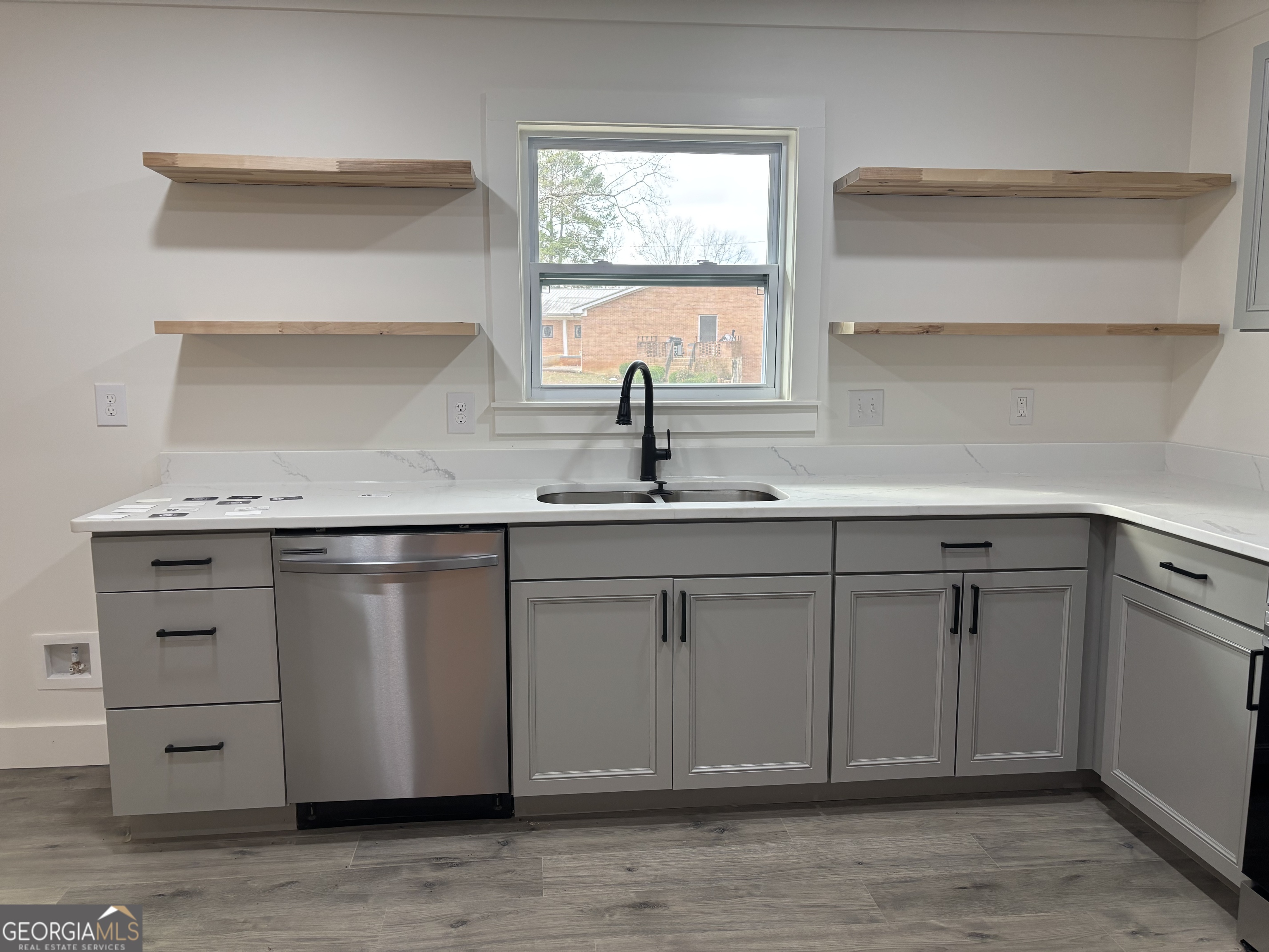 15 Alexander Street Rome, GA 30165 - Photo 5 of 19 a kitchen with cabinets and window