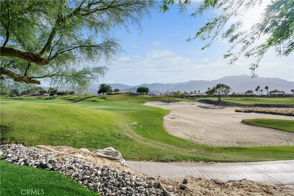 68 Royal St Georges Way Rancho Mirage, CA 92270 - Photo 9 of 75 a view of a lake with a big yard
