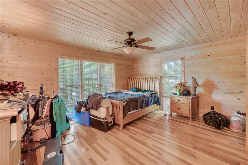1641 Churchwell Rd Union Point Union Point, GA 30669 - Photo 24 of 45 a bedroom with furniture and a large window