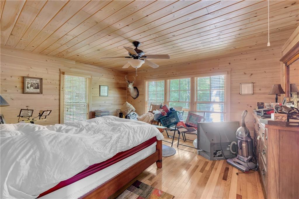 1641 Churchwell Rd Union Point Union Point, GA 30669 - Photo 26 of 45 a bed room with a bed couch and a large window