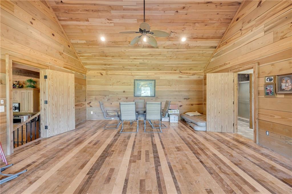 1641 Churchwell Rd Union Point Union Point, GA 30669 - Photo 29 of 45 a spacious bedroom with a bed and a table in it