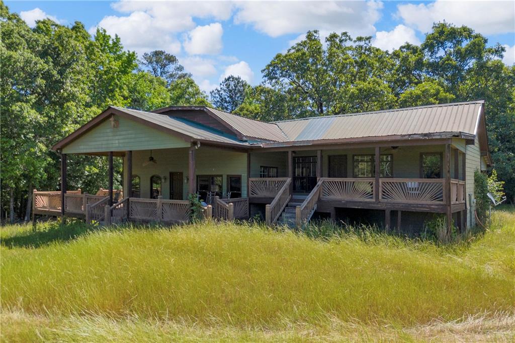 1641 Churchwell Rd Union Point Union Point, GA 30669 - Photo 38 of 45 a view of house with swimming pool and porch with furniture