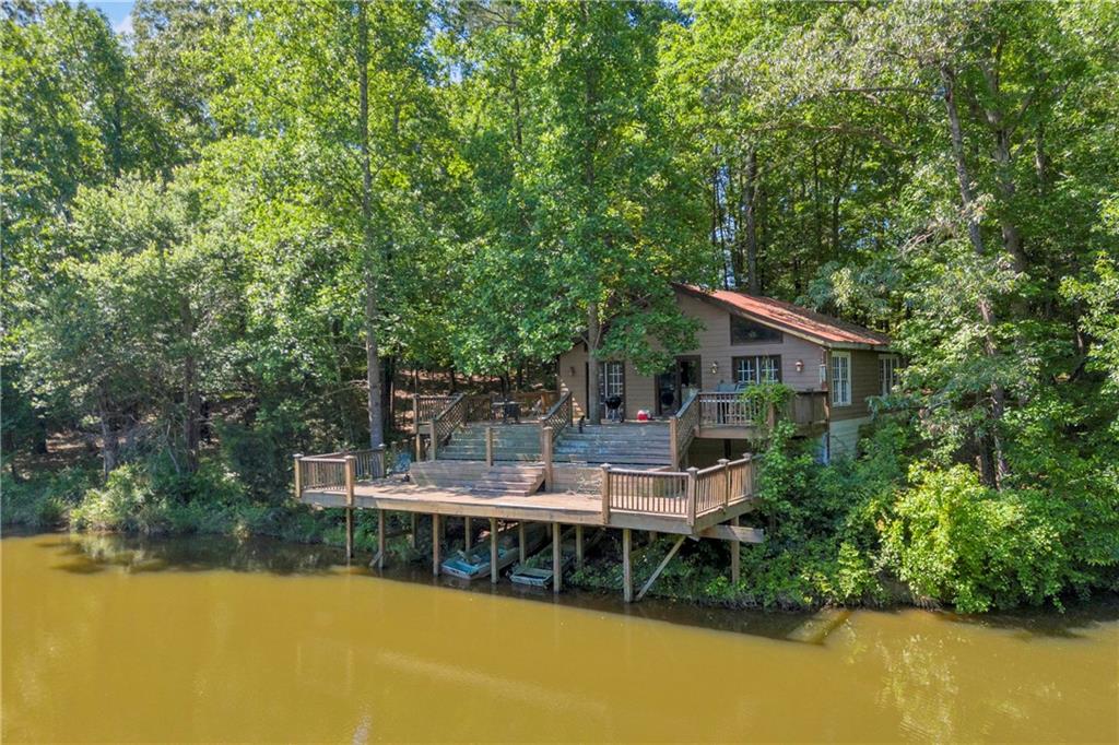 1641 Churchwell Rd Union Point Union Point, GA 30669 - Photo 4 of 45 a house view with swimming pool in garden