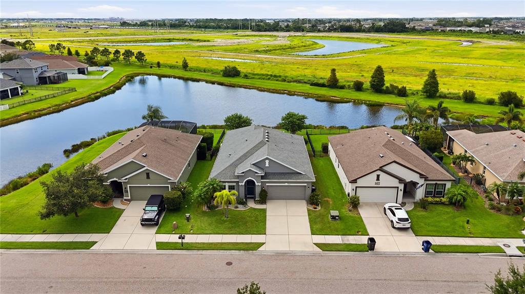 10920 79th Street East Parrish, FL 34219 - Photo 53 of 73 an aerial view of a house with a garden and lake view