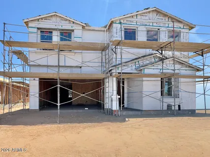a front view of a house with parking