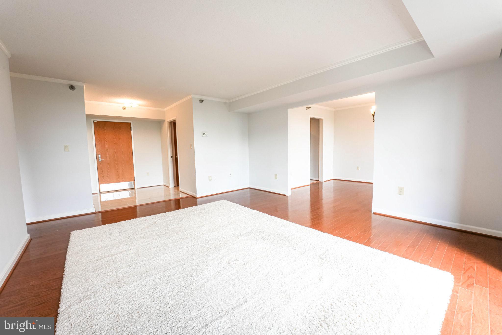 1808 Old Meadow Road, Unit 912 McLean, VA 22102 - Photo 10 of 33 Living room leading to Dining room.
