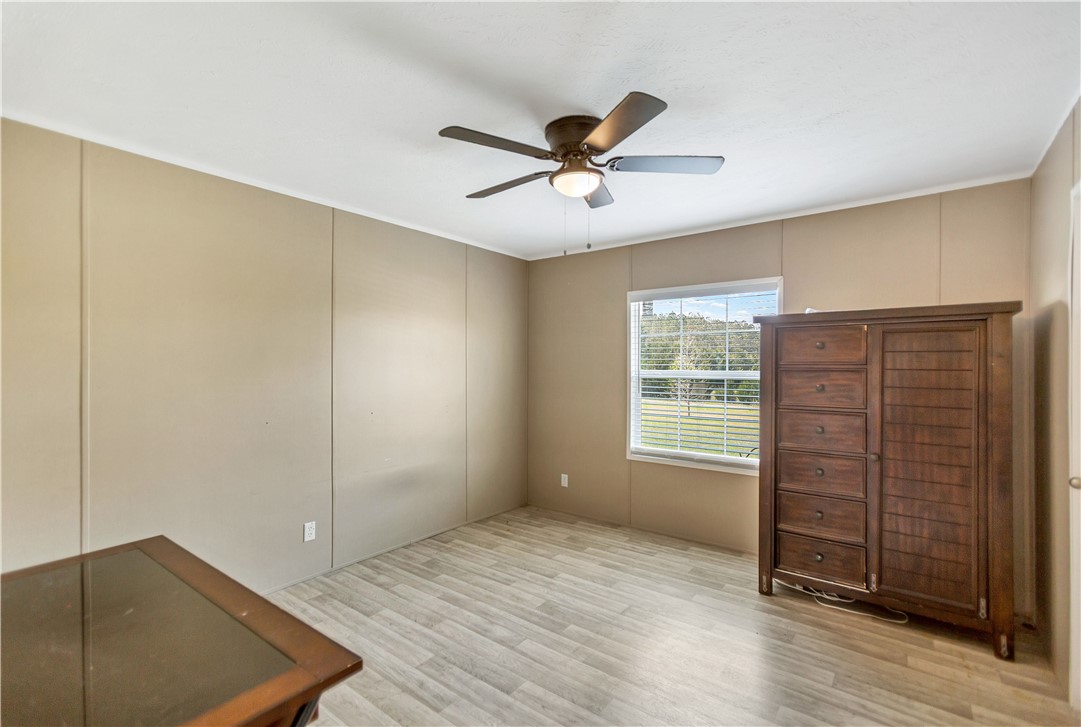 633 Project Road Iva, SC 29655 - Photo 24 of 38 This airy bedroom features light wood flooring and a refreshing view of the outdoors.