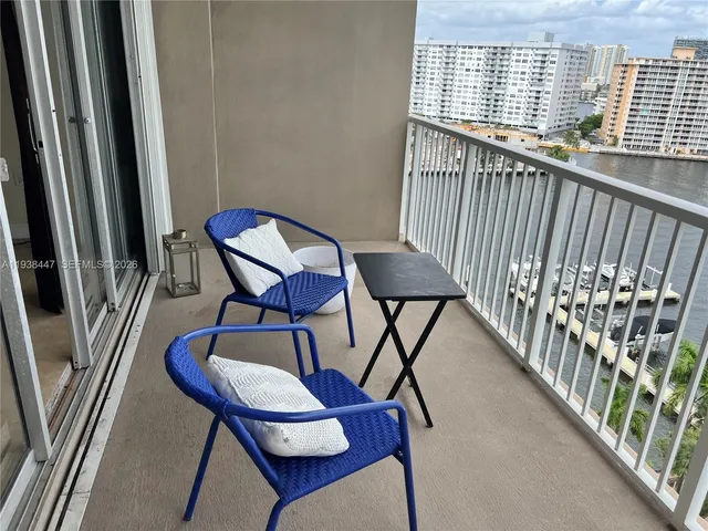 a view of a balcony with furniture