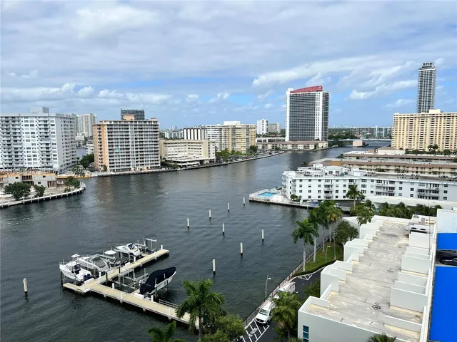 a view of a city with patio and lake view