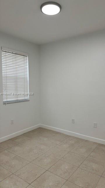 14384 Southwest 11th Street, Unit 904 Pembroke Pines, FL 33027 - Photo 14 of 22 an empty room with a window