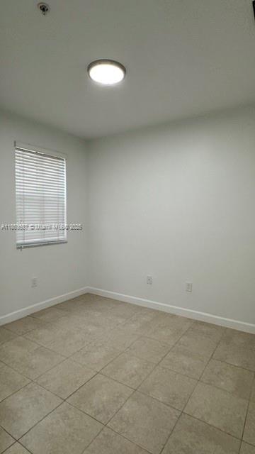 14384 Southwest 11th Street, Unit 904 Pembroke Pines, FL 33027 - Photo 15 of 22 an empty room with a workbench