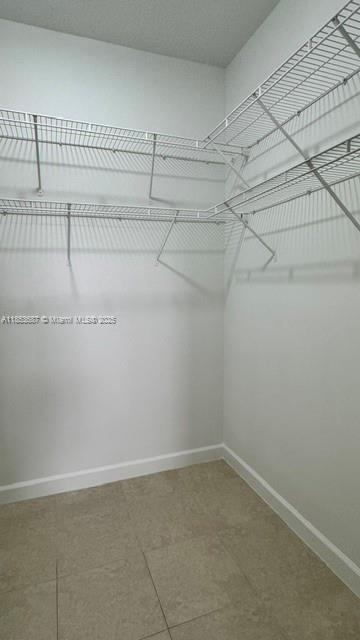 14384 Southwest 11th Street, Unit 904 Pembroke Pines, FL 33027 - Photo 18 of 22 a view of a room with racks on the wall