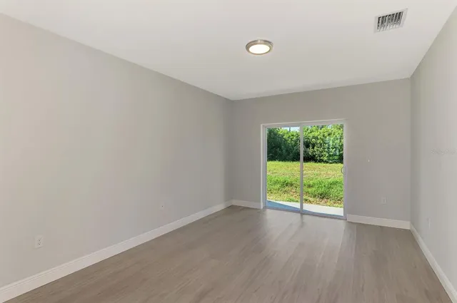a bathroom with a granite countertop sink a toilet and bathtub