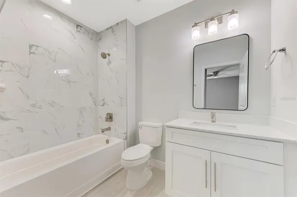 a view of living room with furniture and flat screen tv
