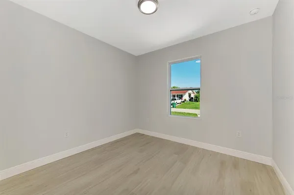 a kitchen with a refrigerator and a stove top oven