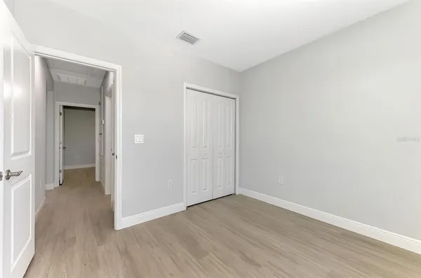 a kitchen with a window a refrigerator and a sink