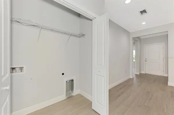a view of a kitchen with a refrigerator and a stove