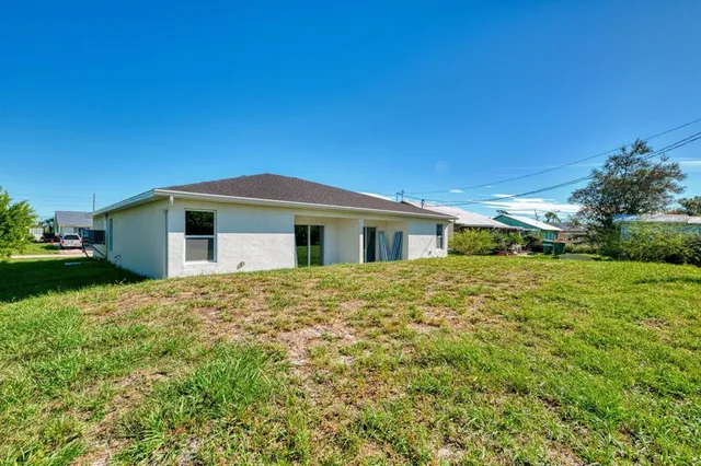 a view of a kitchen with a sink and a refrigerator