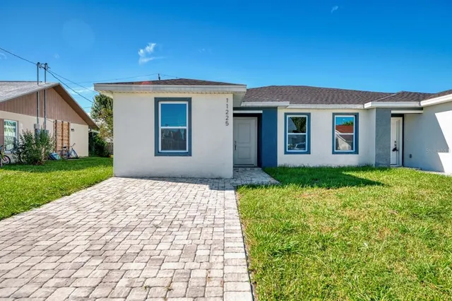 a view of an empty room and wooden floor