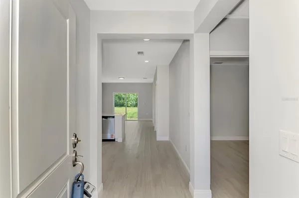 a kitchen with stainless steel appliances a refrigerator and a stove top oven