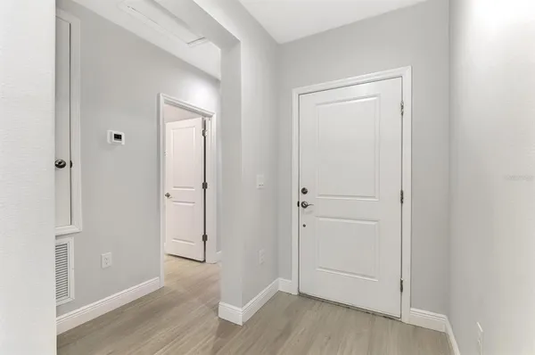a view of a kitchen with a sink and a window