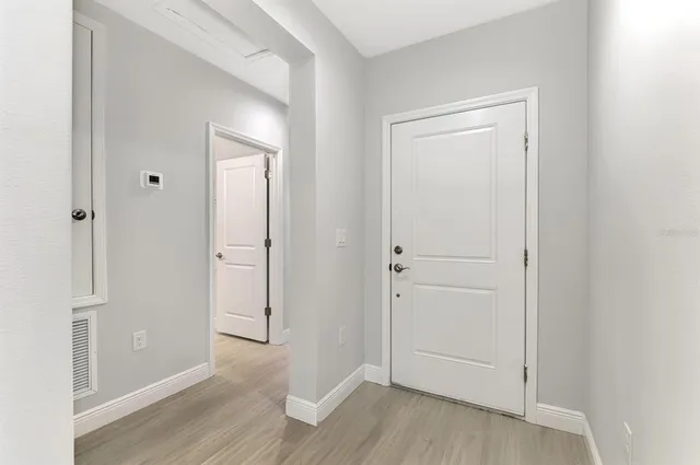 a view of a kitchen with a sink and a window