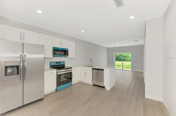a kitchen with a sink and a window