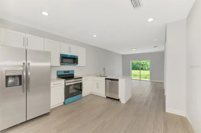 a kitchen with a sink and a window