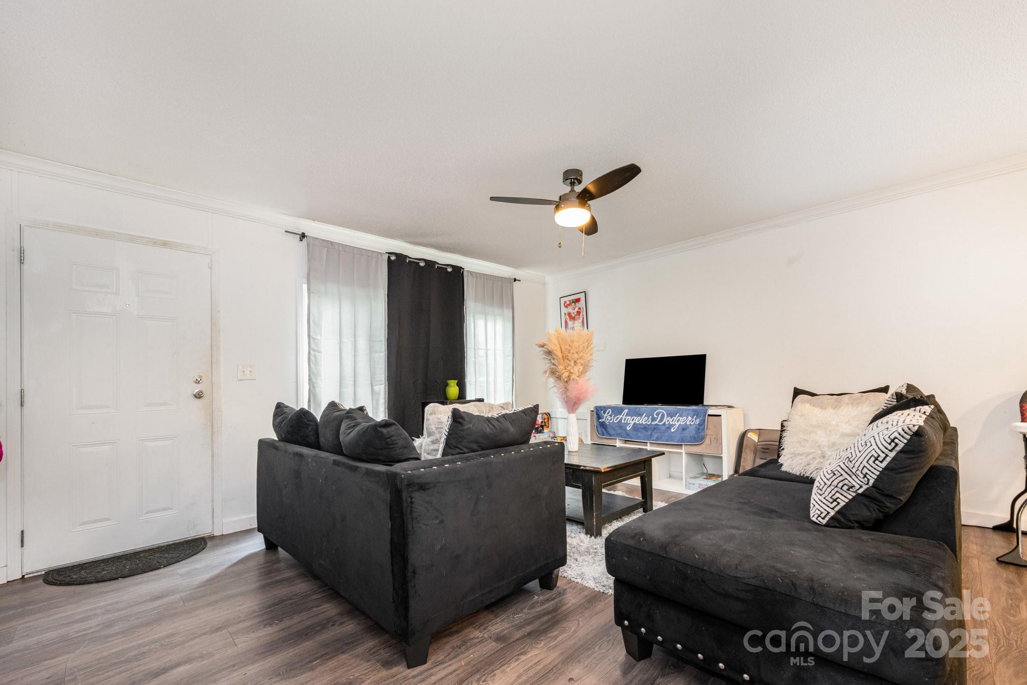 6555 McIntosh Road Stanley, NC 28164 - Photo 3 of 24 a living room with furniture and a flat screen tv