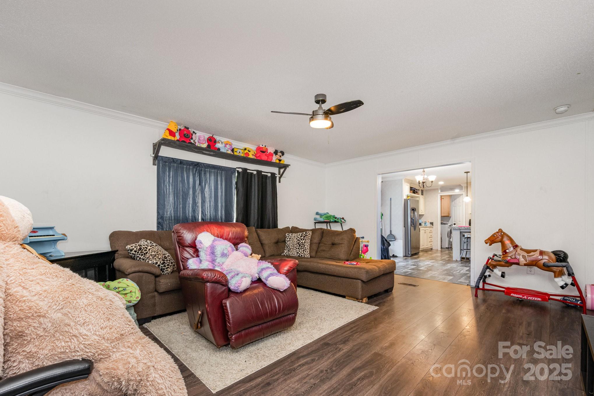 6555 McIntosh Road Stanley, NC 28164 - Photo 8 of 24 a living room with furniture flowerpot and a window