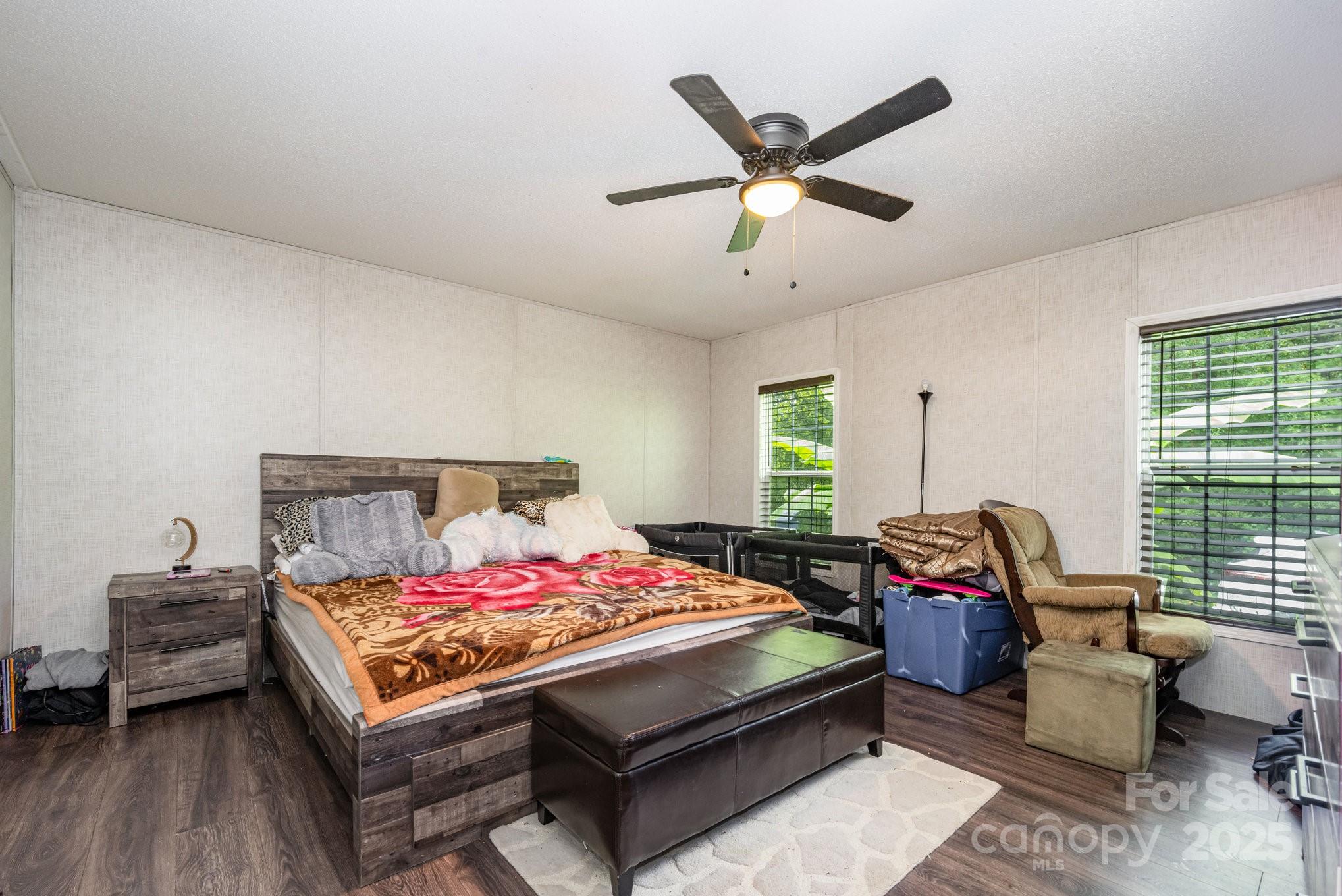 6555 McIntosh Road Stanley, NC 28164 - Photo 10 of 24 a bedroom with a bed a couch and a window