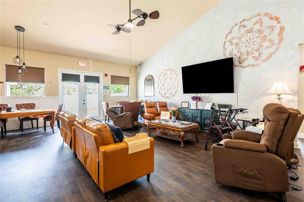 Undisclosed Address Spring Hill, FL 34608 - Photo 6 of 39 a living room with furniture and a flat screen tv