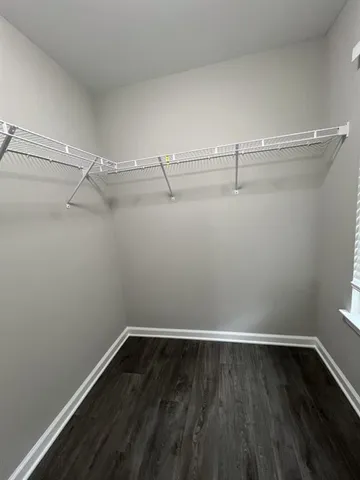 a view of an empty walk in closet