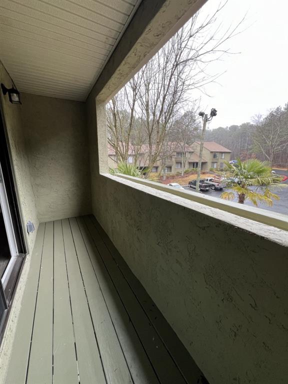 1035 Seasons Parkway Norcross, GA 30093 - Photo 21 of 22 a view of balcony with wooden floor