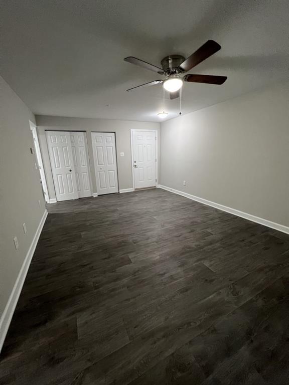 1035 Seasons Parkway Norcross, GA 30093 - Photo 5 of 22 an empty room with wooden floor and windows