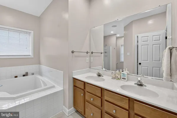 a bathroom with a tub and shower