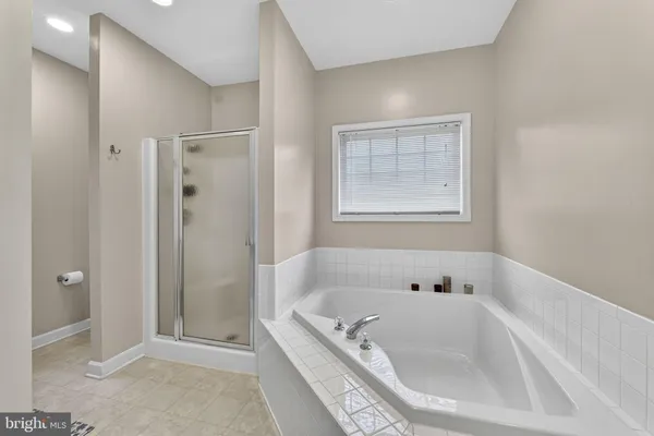 a view of entryway with wooden floor and stairs