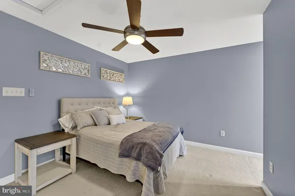 a bedroom with furniture and window
