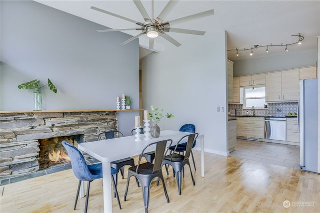 a view of a dining room with furniture and wooden floor