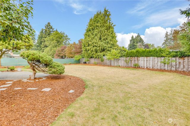 a view of a yard with an outdoor space