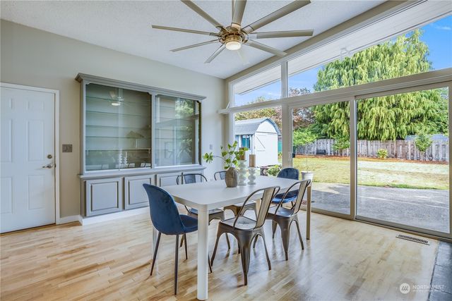 a view of a dining room with furniture window and wooden floor
