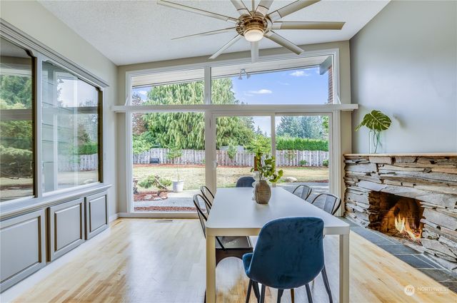 a view of a dining room with furniture window and outside view