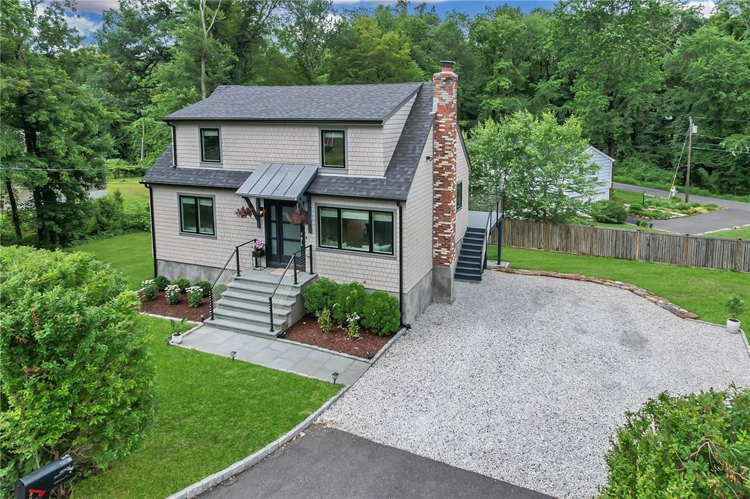 2 Silver Spring Park Ridgefield, CT 06877 - Photo 1 of 1 a front view of a house with garden